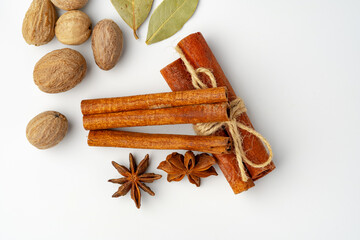 Cinnamon sticks and nutmeg isolated on white background