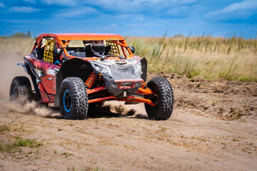 Fototapeta na wymiar UTV buggy offroad vehicle racing on sand. Extreme, adrenalin. 4x4.