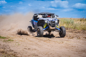 UTV in action offroad vehicle racing on sand dune. Extreme, adrenalin. 4x4.