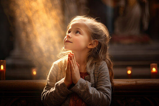 a little girl praying in a church, showing her faith in god and Jesus