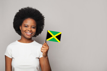 Jamaican woman holding flag of Jamaica Education, business, citizenship and patriotism concept
