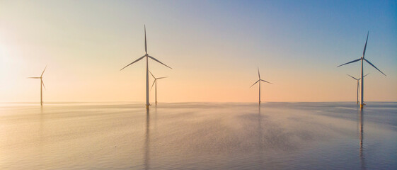 Windmill park in the ocean, drone aerial view of windmill turbines generating green energy electric - obrazy, fototapety, plakaty