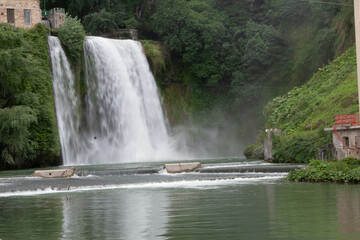 Fototapeta na wymiar Waterfall shot during a sunny day