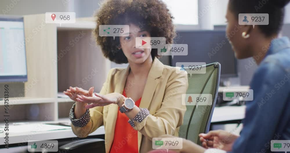 Sticker Animation of notification bars over diverse woman explaining strategy to female coworker on desk