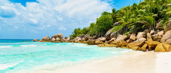 Seychelles La Digue, A white tropical beach with a turquoise colored ocean Grand Anse Beach La Digue Seychelles Islands.