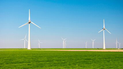 Windmill park in the ocean, drone aerial view of windmill turbines generating green energy, energy transition windmills in the Netherlands. 