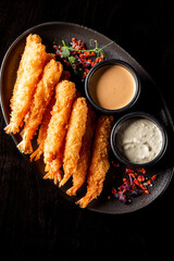 crispy shrimp tempura with garlic sauce on plate