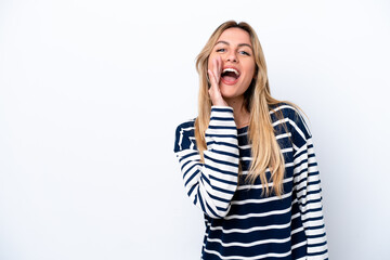 Young Uruguayan woman isolated on white background shouting with mouth wide open