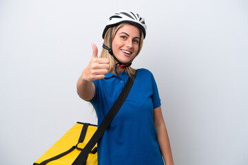 Young caucasian woman with thermal backpack isolated on white background with thumbs up because something good has happened