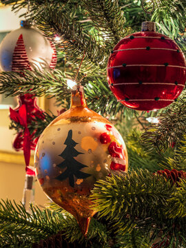 Vintage christmas tree decorations hanging from tree