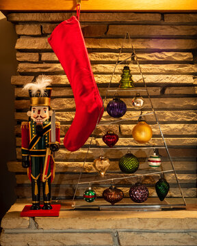 red christmas stocking with nutcracker and ornaments
