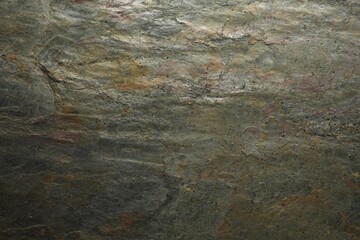 Texture of grey stone surface as background, closeup