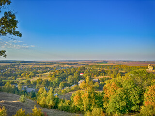 Fototapeta premium Perfect landscape view before the sunset. Warm sunny light and perfect clouds made a beautiful mood