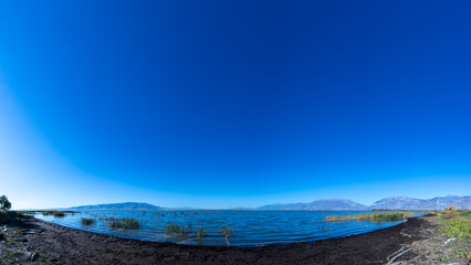 travel usa and north america, Utah lake close to Salt Lake City, panoramic view over the lake on a cloudless day bright sunny day