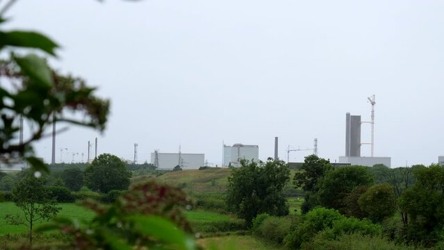 Distant view of Sellafield nuclear power station site distant view in rain.