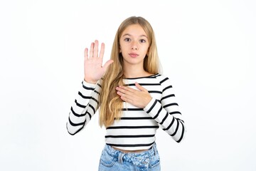 Beautiful teen girl Swearing with hand on chest and open palm, making a loyalty promise oath