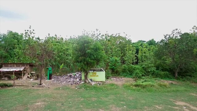 Traditional Aerial Chimney Incinerator manual or chimney for burning waste in empty land areas far from residential areas or Garbage dump. Drone View