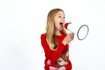 Beautiful girl wearing red knitted sweater Through Megaphone with Available Copy Space