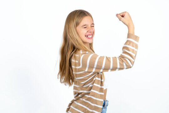 Profile photo of Beautiful teen blonde girl supporting soccer team raise fist shouting