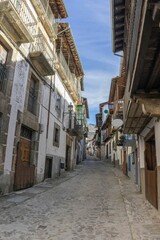 Stone street surrounded by old houses in the medieval village of Candelario, Salamanca, Spain