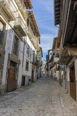 Naklejka premium Stone street surrounded by old houses in the medieval village of Candelario, Salamanca, Spain