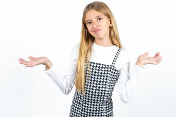Careless attractive Beautifu blonde kid girl shrugging shoulders, oops.