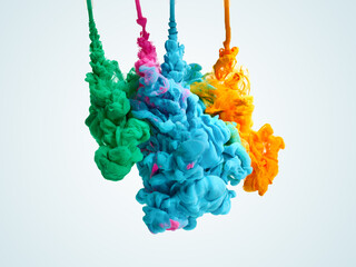 Splash of blended paints in water over light blue background