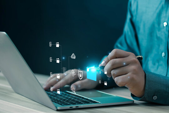 Businessman working on laptop computer documents, manage, files, data, folders, share, digital, information, electronic document management, database, online documents, paperless office concept	