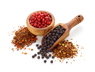 Black pepper in wooden spoon, peppercorn in wooden bowl and crushed pepper isolated on white background
