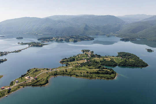 Aerial view of an Island on Ramsko Jezero (Rama lake) in Prozor, Bosnia and Herzegovina.