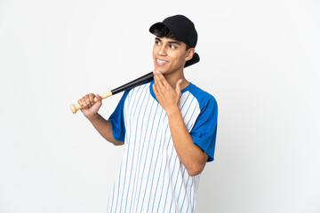 Man playing baseball over isolated white background looking up while smiling