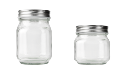 Empty set of two glass jars with silver lid isolated on white.
