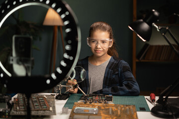 child live-streaming diy computer repair, tech-savvy kid takes on motherboard repair in livestream,...