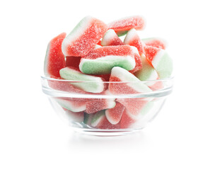 Watermelon jelly candies in bowl isolated on white background.