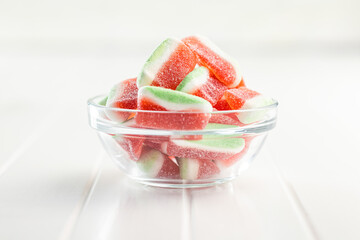 Watermelon jelly candies  in bowl on kitchen table.