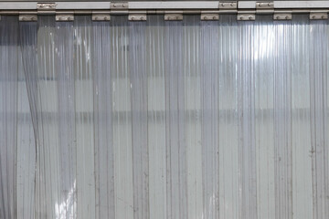 white PVC Curtain of food Industrial warehouse. plastic strip curtain at entrance door.