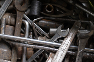 old and rusty wrenches are in toolbox.