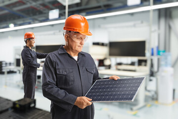 Workers inside a solar panel factory