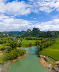 Obraz premium Aerial landscape in Quay Son river, Trung Khanh, Cao Bang, Vietnam with nature, green rice fields and rustic indigenous houses