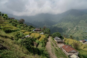 Fototapeta premium a view of a village and mountain area with a valley