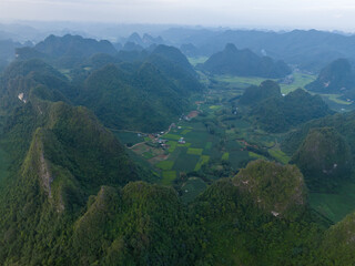 Aerial view of Thung mountain in Tra Linh, Cao Bang province, Vietnam with lake, cloudy, nature.