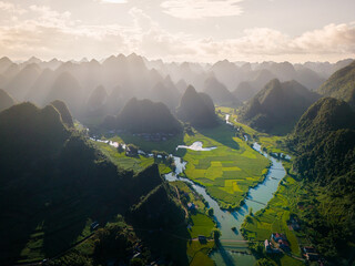 Aerial landscape in Phong Nam valley, an extreme scenery landscape at Cao bang province, Vietnam with river, nature, green rice fields
