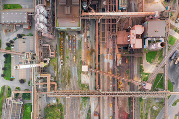 Steel factory from above. Birds-eye view of a bustling steel production unit, highlighting the...