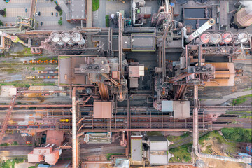 Steel factory from above. Overhead view of a vibrant steel production center with a myriad of...