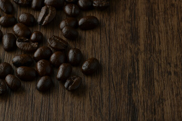 Roasted coffee bean on wooden table.