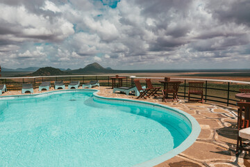 View of a swimming pool against a scenic view point at Tsavo East National Park, Kenya