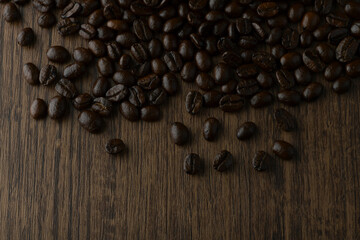 Roasted coffee bean on wooden table.