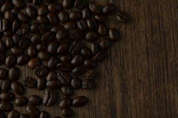 Roasted coffee bean on wooden table.