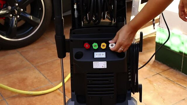 we show pressure gun washing a high-end car with specialized tools with advanced technology.