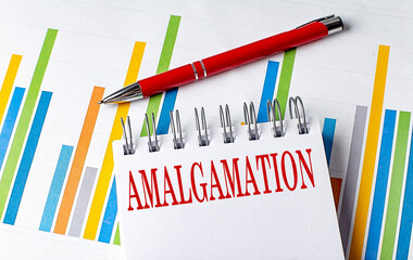 AMALGAMATION text on a notebook with chart and pen business concept